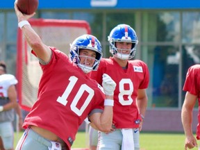 Quarterback Eli Manning (10) and rookie QB Daniel Jones (8) participate in training camp practice at New York Giants headquarters East Rutherford, N.J., on Sunday, July 28, 2019.