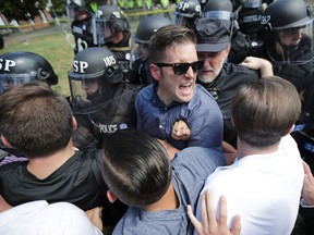 White nationalist Richard Spencer and his supporters clash with Virginia State Police in Lee Park August 12, 2017 in Charlottesville, Virginia. (Chip Somodevilla/Getty Images)