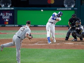 American League's Joey Gallo, of the Texas Rangers, hits a solo home run off National League pitcher Will Smith, of the San Francisco Giants, during the seventh inning of the MLB baseball All-Star Game, Tuesday, July 9, 2019, in Cleveland.