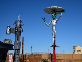 An Alien sculpture lines the side of the road in the town of Baker, California, which claims the world's largest thermometer at 134 feet, and it also known as the 'Gateway to Area 51' on March 4, 2019. - The Alien sculptures are part of the business Alien Fresh Jerky remains a popular spot for a break for drivers going to and from Los Angeles to Las Vegas.