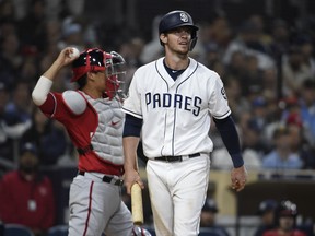 Wil Myers #4 of the San Diego Padres walks away after striking out during the eighth inning of a baseball game against the Washington Nationals at Petco Park June 8, 2019 in San Diego, California.  (Photo by Denis Poroy/Getty Images)