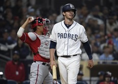 Wil Myers #4 of the San Diego Padres walks away after striking out during the eighth inning of a baseball game against the Washington Nationals at Petco Park June 8, 2019 in San Diego, California. (Photo by Denis Poroy/Getty Images)
