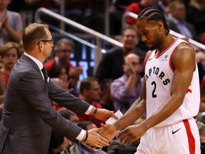 Kawhi Leonard #2 of the Toronto Raptors is greeted by head coach Nick Nurse of the in Game 4 of the NBA Eastern Conference Finals against the Milwaukee Bucks at Scotiabank Arena on May 21, 2019 in Toronto. (Photo by Gregory Shamus/Getty Images)