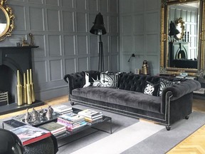 Black furnishings, a lamp and a marble coffee table combine to create a darkly dramatic interior in our Glasgow abode.
