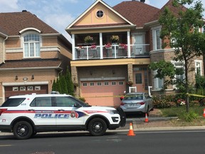 York Regional Police at a home on Castlemore Ave. in Markham on Monday, July 29, 2019, the day after four people were found murdered. (Kevin Connor/Toronto Sun)