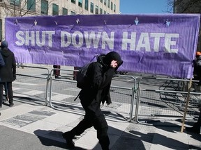 Pro-Immigration groups and members of PEGIDA are separated by fences and police on University Avenue and Armoury Street  on Saturday March 23, 2019 in Toronto.  Veronica Henri/Toronto Sun/Postmedia Network