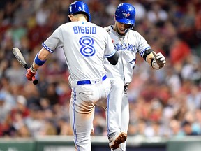 Toronto Blue Jays left fielder Lourdes Gurriel Jr. celebrates with Cavan Biggio (8) after hitting a home run against the Boston Red Sox at Fenway Park. (Brian Fluharty-USA TODAY Sports)