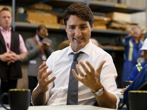 Prime Minister Justin Trudeau meets with energy workers at Kinder Morgan's Trans Mountain pipeline terminal in Edmonton, on Friday, July 12, 2019.