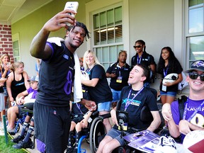 Baltimore Ravens quarterback Lamar Jackson (8) takes a picture with fans during training camp at Under Armour Performance Center. (Evan Habeeb-USA TODAY Sports)