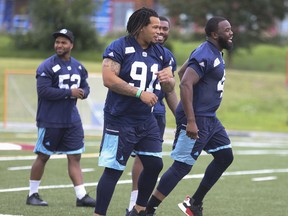 Argos’ Shawn Lemon (right) stayed home during Toronto’s three-game western road trip. (JACK BOLAND/TORONTO SUN FILES)