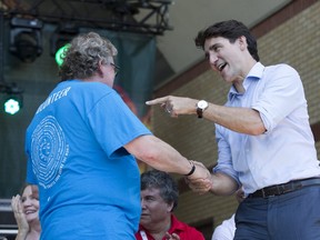 Mayor Ed Holder welcomes Prime Minister Justin Trudeau to London as Trudeau makes a special appearance at the opening ceremonies of Sunfest at Victoria Park in London, Ont. on Thursday July 4, 2019.