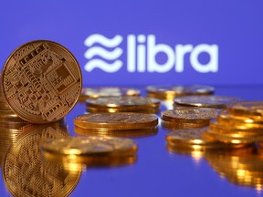 Representations of virtual currency are displayed in front of the Libra logo in this illustration picture, June 21, 2019.