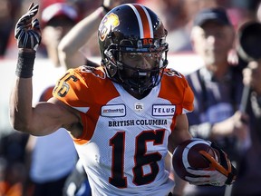 B.C. Lions' Bryan Burnham runs the ball during CFL action against the Calgary Stampeders, in Calgary, Saturday, June 29, 2019. (THE CANADIAN PRESS/Jeff McIntosh)