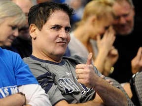 Dallas Mavericks owner Mark Cuban gives a thumbs up while watching his team take on the Miami Heat at the American Airlines Center. (File photo)