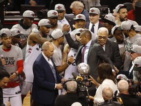 Kawhi Leonard (left) and team president Masai Ujiri shake hands after winning the East final. (Jack Boland/Toronto Sun)