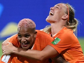 Netherlands' players celebrate at the end of the France 2019 Women's World Cup semi-final football match between the Netherlands and Sweden, on July 3, 2019, at the Lyon Stadium in Decines-Charpieu, central-eastern France.