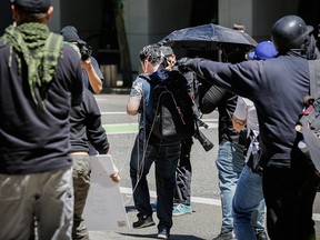 Andy Ngo, a Portland-based journalist, is seen covered in pepper spray and silly string after unidentified Rose City Antifa members attacked him on June 29, 2019 in Portland, Ore.