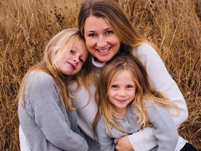 Sarah Cotton holds her daughters Chloe, left, and Aubrey Berry in October 2017 in this handout photo.  THE CANADIAN PRESS/HO, Ryan MacDonald Photography