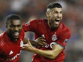 Ashtone Morgan (left), Jonathan Osorio and the rest of the Reds know full-well they can’t afford to take bottom-feeder Cincinnati lightly on Saturday night at BMO Field. (USA TODAY SPORTS PHOTO)