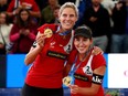 Sarah Pavan (left) and Melissa Humana Paredes (right) of Canada pose with their gold medals after winning the FIVB Beach Volleyball World Championships at Rothenbaum Stadion  in Hamburg, Germany, on July 6, 2019.