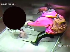 Investigators need help identifying a purse snatcher who robbed a woman in a condo elevator near St. Clair Ave. W. and Avenue Rd. on June 1, 2019. (Toronto Police video screen capture)