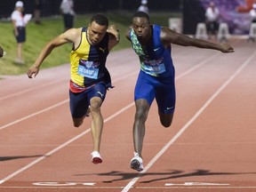 Aaron Brown (right) beats Andre De Grasse to win gold in the men’s 100-metre final at the Canadian Track and Field Championships in Montreal.  THE CANADIAN PRESS