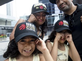 Amber, Maya, their mom Tima and Jagdeep Kang mourn the loss of Kawhi Leonard to the LA Clippers on Saturday July 6, 2019. (Stan Behal/Toronto Sun/Postmedia Network)