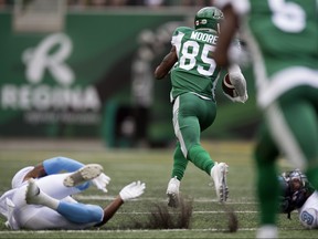 Kyran Moore of the Saskatchewan Roughriders takes a pass in for a touchdown after two Argos collided with each other in the secondary at Mosaic Stadium in Regina. TROY FLEECE / Postmedia Network