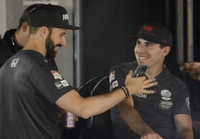 Canadian racing drivers James Hinchcliffe, left, and Robert Wickens share a laugh at the Honda Indy in Toronto, on Thursday, July 11, 2019. (Andrew Lahodynskyj/The Canadian Press)