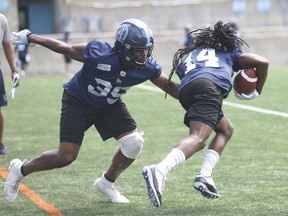 Argonauts’ Robbie Smith (left) missed a key tackle last week against the Bombers. (JACK BOLAND/TORONTO SUN)