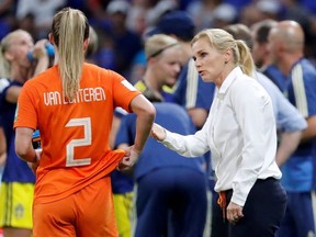 Soccer Football - Women's Netherlands coach Sarina Wiegman gives instructions to Netherlands' Desiree van Lunteren during a water break at the Stade de Lyon on Wednesday June 3, 2019.