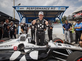 Simon Pagenaud of France celebrates after winning first pole position during qualifying at the 2019 Honda Indy Toronto, in Toronto, Saturday July 13, 2019. THE CANADIAN PRESS/Mark Blinch