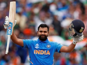 India's Rohit Sharma celebrates his century during a Cricket World Cup game against Bangladesh on July 2, 2019, in Birmingham, England, (ANDREW BOYERS/Reuters)