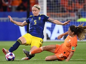 Sweden's defender Nilla Fischer (L) vies with Netherlands' midfielder Danielle van de Donk during the France 2019 Women's World Cup semifinal football match between the Netherlands and Sweden, on July 3, 2019, at the Lyon Stadium in Lyon, France.