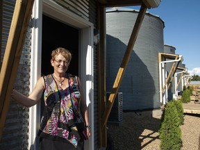 Julie Hilling, owner/operator of the Bin There Campground east of Moose Jaw, Sask., poses in front her refurbished and air-conditioned grain bins for rent on Thursday, July 18, 2019.