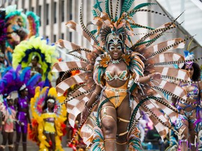 Mas dancers take the stage during the official Toronto Caribbean Carnival launch event at Nathan Phillips Square in Toronto, Ont. on Tuesday July 9, 2019. Ernest Doroszuk/Toronto Sun/Postmedia