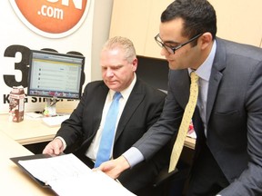 Then city councillor Doug Ford, left, with executive assistant Amin Massoudi, visits the Toronto Sun for an online chat with readers January 17, 2013. Veronica Henri/Toronto Sun