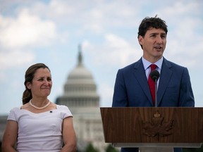 Canada's Prime Minister Justin Trudeau speaks as Canada's Foreign Minister Chrystia Freeland listens during a news conference at the Canadian Embassy, in Washington, U.S. June 20, 2019.