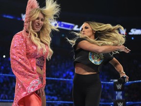 WWE Hall of Famer Trish Stratus slaps her SummerSlam opponent, Charlotte Flair, on Smackdown Live, on Sept. 6, 2019. (WWE Photo)