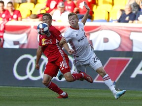 New York Red Bulls defender Race Buckmaster defends against Toronto FC midfielder Jacob Shaffelburg during Saturday's game. (USA TODAY SPORTS)