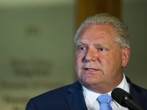 Ontario Premier Doug Ford speaks to media outside of his office at Queen's Park in Toronto July 11, 2018.