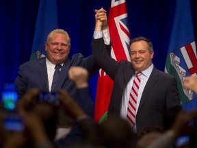 Jason Kenney, right, and Doug Ford during the Scrap the Carbon Tax Rally in Calgary on October 5, 2018. Leah Hennel/Postmedia