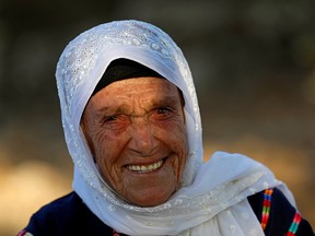Muftia, the grandmother of U.S. congresswoman Rashida Tlaib, looks on outside her house in the village of Beit Ur Al-Fauqa in the Israeli-occupied West Bank August 16, 2019. (REUTERS/Mohamad Torokman)