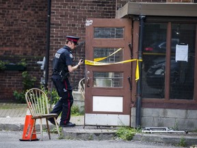 A police officer at the scene of a deadly stabbing at St. Matthew's United Church near St. Clair Ave. W. and Rushton Rd. on Wednesday, Aug. 7 2019