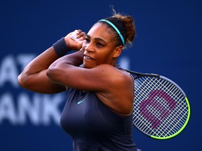 Serena Williams hits a shot against Naomi Osaka during a quarter-final match on Day 7 of the Rogers Cup at Aviva Centre on August 9, 2019 in Toronto.  (Vaughn Ridley/Getty Images)