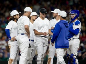 Sam Gaviglio of the Toronto Blue Jays is taken out of the game after walking in a run against the Seattle Mariners in the sixth inning at T-Mobile Park on August 23, 2019 in Seattle, Washington. Teams are wearing special color schemed uniforms with players choosing nicknames to display for Players' Weekend. (Photo by Lindsey Wasson/Getty Images)