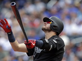 Josh Donaldson #20 of the Atlanta Braves watches his solo home run during the second inning against the New York Mets at Citi Field on August 25, 2019 in New York City.  (Photo by Adam Hunger/Getty Images)