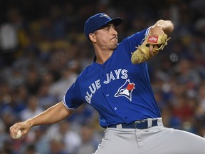Jacob Waguespack of the Toronto Blue Jays pitches during the second inning against the Los Angeles Dodgers at Dodger Stadium on August 22, 2019 in Los Angeles, California. (Photo by Harry How/Getty Images)