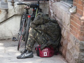 A man is pictured near the 21 Park Rd. respite centre on Aug. 12, 2019. (Craig Robertson, Toronto Sun)