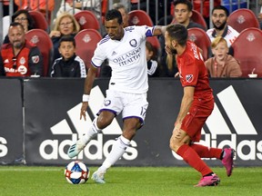 Orlando City's Nani and Toronto FC's Nicolas Benezet fight for the ball during last week's game. (USA TODAY SPORTS)